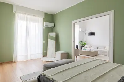 Letto o letti in una camera di Marittimo Luxury Apartment con vista Vesuvio