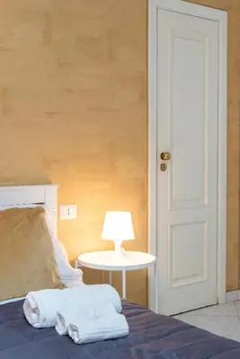 Letto o letti in una camera di Napoli centro, DM suites
