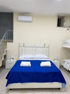 Letto o letti in una camera di Basso ai Quartieri experience