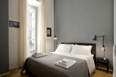 Letto o letti in una camera di SeaFront Loft Napoli