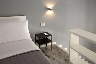 Letto o letti in una camera di SeaFront Loft Napoli