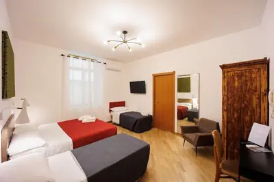 Letto o letti in una camera di Dante Apartament for Group and Family By HouseinNaples