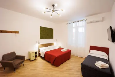 Letto o letti in una camera di Dante Apartament for Group and Family By HouseinNaples