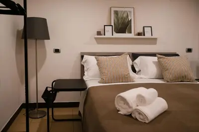 Letto o letti in una camera di La casa del Gigante - Napoli