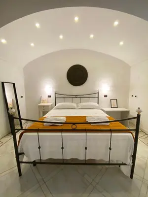 Letto o letti in una camera di Cuore di Napoli