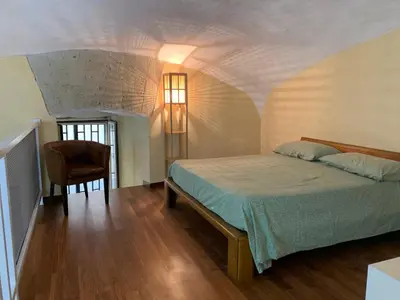 Letto o letti in una camera di La casa nel tufo