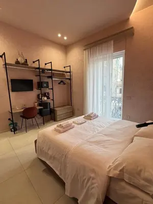 Letto o letti in una camera di Momó
