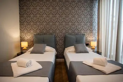 Letto o letti in una camera di Boemì smart suites