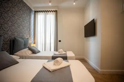Letto o letti in una camera di Boemì smart suites