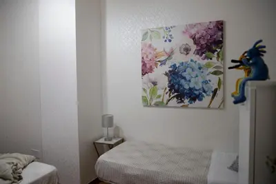 Letto o letti in una camera di Grandi Residenze Napoli- Piazza Carità con vista