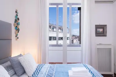 Letto o letti in una camera di Grandi Residenze Napoli- Piazza Carità con vista