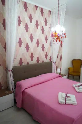 Letto o letti in una camera di Casa Sissy