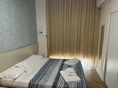 Letto o letti in una camera di Rooms Garibaldi