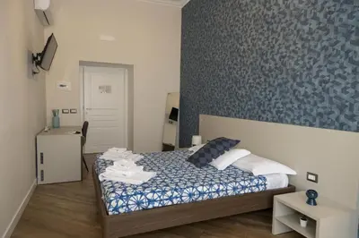 Letto o letti in una camera di Rooms Garibaldi