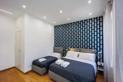 Letto o letti in una camera di Pisanelli Blu By HouseinNaples