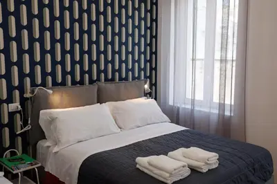 Letto o letti in una camera di Pisanelli Blu By HouseinNaples