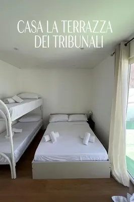 Letto o letti in una camera di casa la terrazza dei tribunali