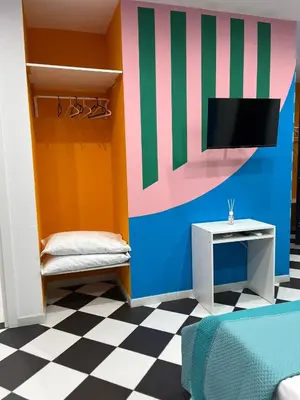Letto o letti in una camera di Barrios Napoli