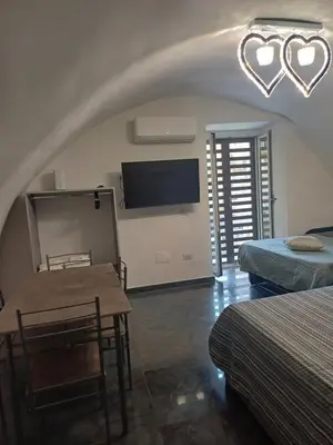 Letto o letti in una camera di Casa Vacanza Annamaria