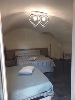 Letto o letti in una camera di Casa Vacanza Annamaria