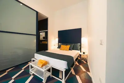 Letto o letti in una camera di Bovio apartment & rooms