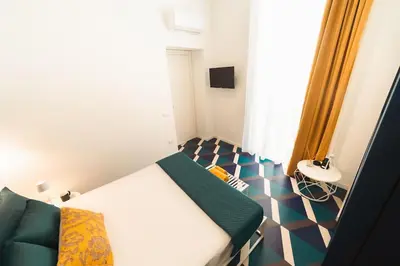 TV o dispositivi per l'intrattenimento presso Bovio apartment & rooms