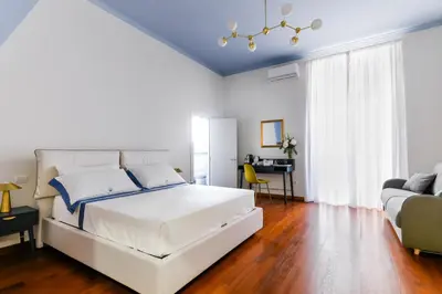 Letto o letti in una camera di Tarsia 42 Suites Napoli