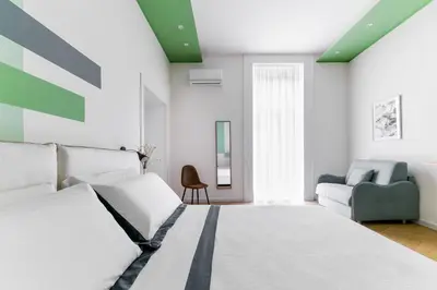 Letto o letti in una camera di Tarsia 42 Suites Napoli