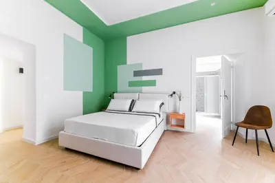 Letto o letti in una camera di Tarsia 42 Suites Napoli