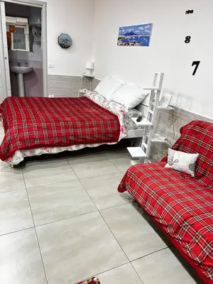 Letto o letti in una camera di B&B Rifugio Partenopeo - Centro Storico di Napoli