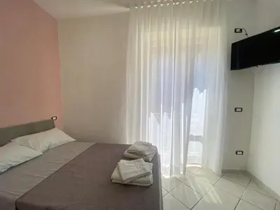 Letto o letti in una camera di Appartamento Orchidea