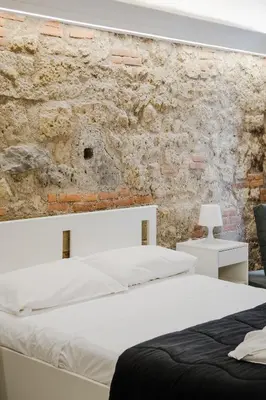 Letto o letti in una camera di Dimora Velato By Dimorra