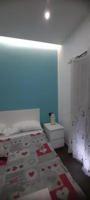 Letto o letti in una camera di B&B Locanda Mediterranea