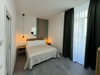 Letto o letti in una camera di Incoming Cesare Cortese