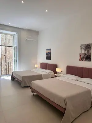 Letto o letti in una camera di Blu Parthenope a Spaccanapoli