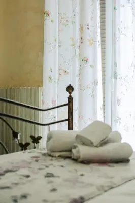 Letto o letti in una camera di Regina's Apartment