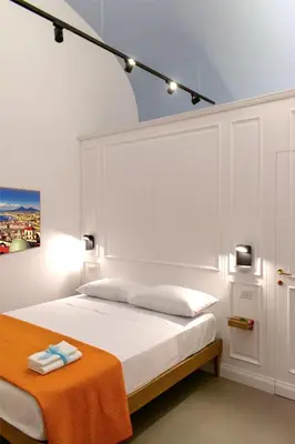 Letto o letti in una camera di Relais Don Pedro de Toledo