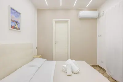 Letto o letti in una camera di Nalusa Superior Chiaia - nel cuore della citta