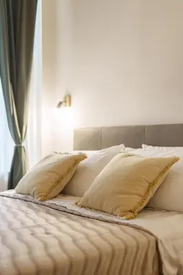 Letto o letti in una camera di Alfonsina Guest Room