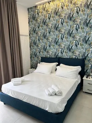 Letto o letti in una camera di Enjoy rooms Naples