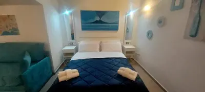 Letto o letti in una camera di Neapolis Mini Flat