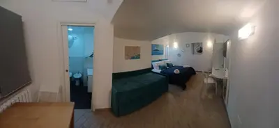Area soggiorno di Neapolis Mini Flat