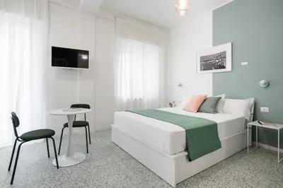 Letto o letti in una camera di Mira Maradona