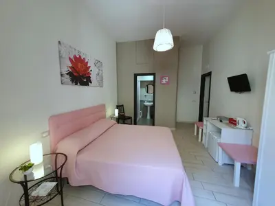 Letto o letti in una camera di Domus Armenio