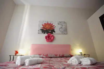 Letto o letti in una camera di Domus Armenio