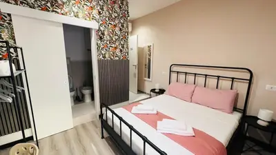 Letto o letti in una camera di Flower rooms