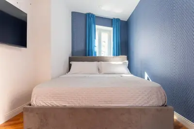 Letto o letti in una camera di Panorama Suite Napoli