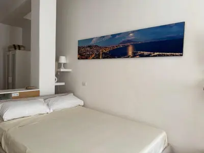 Letto o letti in una camera di La Casa di Ciui ad un passo da Via Toledo