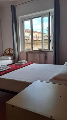 Letto o letti in una camera di Trinita' Maggiore Home/ Historic Center