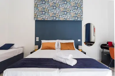 Letto o letti in una camera di Casa Mancini By DomusExtra
